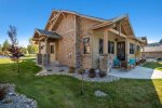 Private covered patio with furniture and Weber natural gas barbeque
