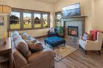 Gorgeous living area with tv and gas fireplace