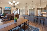 Dining area with seating for 6, plus 2 barstools for additional seating