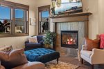 Gorgeous living area with tv and gas fireplace