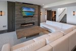 Downstairs family room opens up to the yard and lake. 