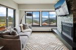 Main level family room with Smart TV, gas fireplace & views of the lake