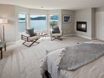 Primary bedroom with King bed, and sitting area with views of the lake