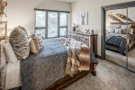 Queen bedroom in suite on the lower level.