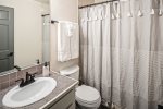 Separate full bathroom located next to King bedroom downstairs.  