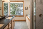 Master bath with soaking tub and separate shower.
