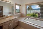 Primary suite with soaking tub. 