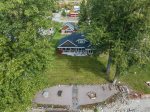 Aerial of home and guest house in background.