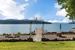 Bistro lights add ambiance to fire pit and private dock area.