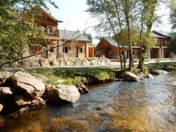 Riverside resort condo. Steps from pool & hot tub. 5-minute walk to downtown Estes Park. 