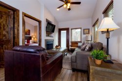 Dog-friendly condo adjacent to fire pit, grills. Steps from riverwalk into downtown Estes Park. 