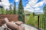 Main Deck Lounge Corner with Summer Seating and Stunning Mountain Views