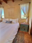 King bedroom with plus bedding and westward views 