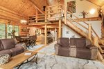 Living room with stairs to master loft