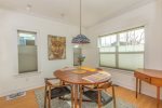 Seating for 4 at the dining room table, and a small work area.