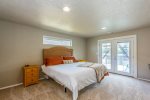 This charming master bedroom has a King-sized bed, private balcony, and a relaxing vibe to end the night in