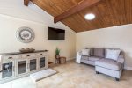 Smart TV and pull out sofa off the dining room