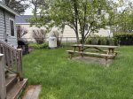 back yard with picnic table and gas grill