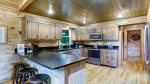 OPEN KITCHEN w/BREAKFAST COUNTER & NEWLY STAINED CABINETS