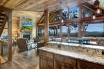 KITCHEN TO LIVING RM AGAINST MOUNTAIN BACKDROP