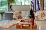 POUR, SIP, SAVOR ON SCREENED-IN DECK DINING TABLE
