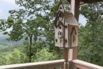 DECORATIVE CORNER BIRD HOUSE ON PRIVATE DECK
