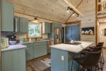 KITCHEN w/GAS COOKTOP ISLAND & 4 SLEEK LEATHER BAR STOOLS