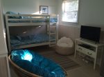 Bunk beds and TV in bonus sleeping room