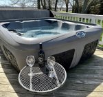 Unwind in the Hot Tub with a glass of wine 
