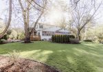 Large yard surrounds this two story lakeshore home