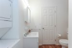 Jack and Jill bathroom with washer and dryer