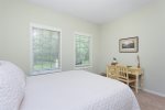 Bedroom with a queen bed and writing desk