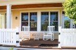 Front porch rocking chairs in a peaceful setting