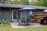 Outdoor dining table with gas grill and umbrella 