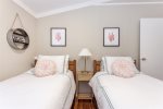 Two cozy twin beds off the hall