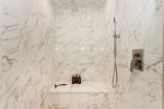 Huge steam shower with custom tile off the primary suite