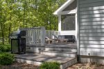 Lovely back deck area with Chaise lounges and globe lights