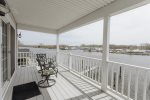 Second story deck with seating and views of the river