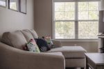 Nap or enjoy a book on the second floor sofa