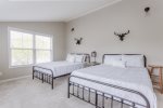 Get a great night`s sleep in this spacious bedroom with 2 Queen beds