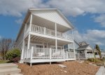 Home has decks on both stories for plenty of time by the water