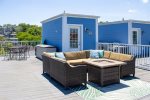 Furnished roof top deck with dinette and sectional 