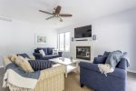 Sunny living room overlooking the pool area