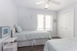 Upstairs bedroom with two twin beds 