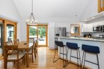 Kitchen and dining area with extra seating at the bar 