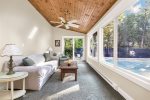 Sunroom with access to the pool area