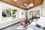 View from the sunroom into the dining area with views of the pool