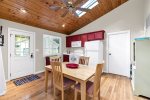 Enjoy a cup of coffee around this small table in the kitchen