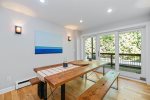 Large wooden dining table just off the kitchen 