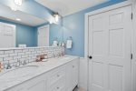 Upstairs bathroom with double sinks 